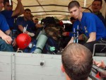 Jurnalis asal Rusia mengajukan diri naik mobil truk  Tim SAR Rusia di Lapangan SMPN CIjeruk, Kabupaten Bogor, Minggu, (13/05). Tim SAR Rusia tersebut akan berangkat mengevakuasi bangkai pesawat Sukhoi yang terjatuh di Gunung Salak. FOTO : AHMAD FAUZAN SAZLI